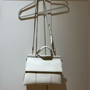 Cream leather Tory Burch purse.